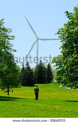 Giant Wind Turbine Providing Green Renewable Power To Homes