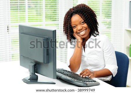 Beautiful Happy Female African American Office Worker Sat At Her Computer