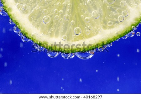 Slice Of Lime In A Glass Of Sparkling Water
