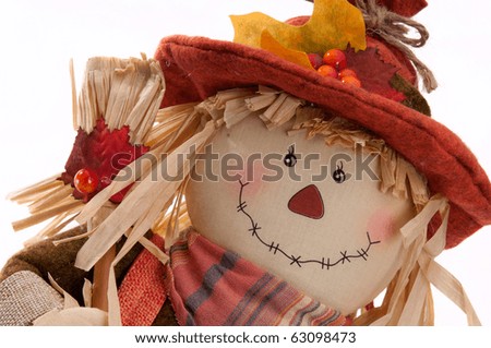 Fall Decoration Of A Stuffed Decorative Scarecrow For Thanksgiving Celebrations, Cut-Out On A White Background