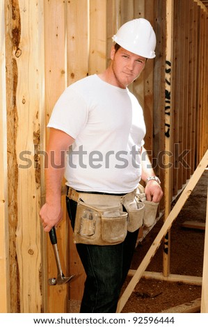 General Contractor Builder Using A Hammer While Building A New Home