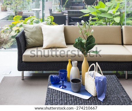 set decoration with wicker sofa