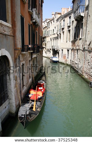 One of Venice canals and famous touristic attraction - gondola. Italy
