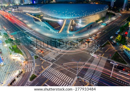 SEOUL, SOUTH KOREA - MAY 31: Late night traffic blurs past Dongdaemun Design Plaza in Seoul on MAY 31,2014,Seoul, South Korea.