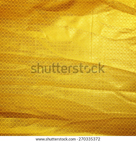 Gold creased fabric silk for background