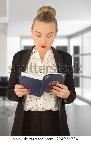 young girl reading a book/beautiful young woman holding a book in his hands