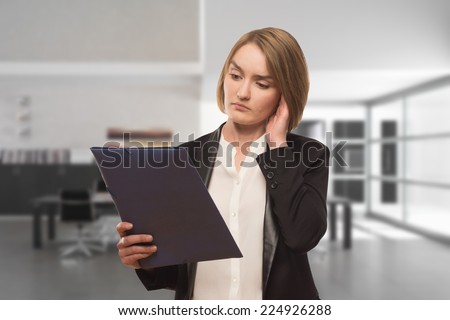 nervous girl/nervous girl with a folder in hands