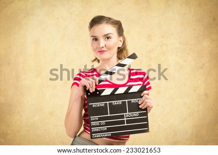 worker film industry/ young girl with a clapperboard cinema