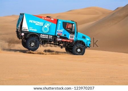 ICA, PERU - JAN. 05: Gerard De Rooy  (NLD) and his team,  drive his truck during the participation on Rally Dakar 2013, JAN 05, 2013 in Ica, Peru.
