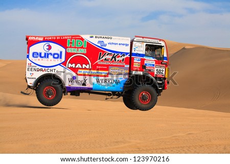 ICA, PERU - JAN. 05: Marcel Van Vliet (NLD) and his team,  drive  and jump his truck during the  participation on Rally Dakar 2013, JAN 05, 2013 in Ica, Peru.