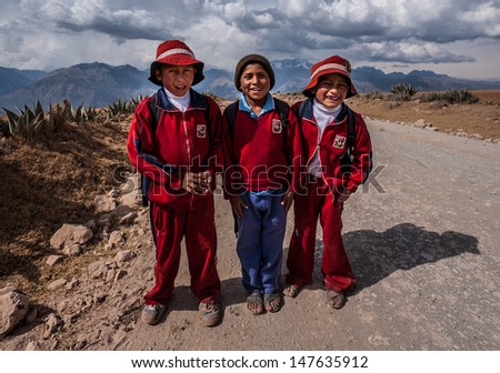 CUZCO, PERU CIRCA 2012: Portrait of not identified 10 years boys in traditional school dresses circa 2012 in Cuzco, Peru. Some children have to walk 2 hours a day for to go school in Peruvian mountain