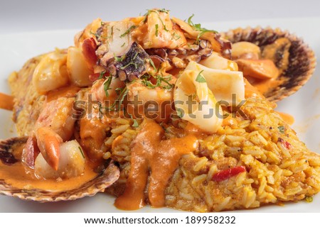 PERUVIAN FOOD: Beans an rices with seafood sauce, called \