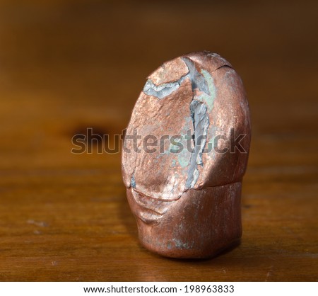 Ricochet full metal jacket bullet on wood