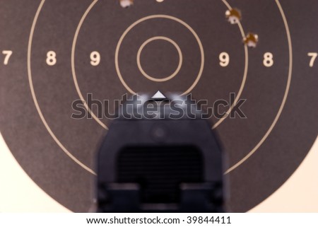 Looking over sights of a 9mm automatic pistol