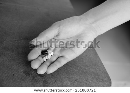 Woman hand on white background  I deliberately made incorrect white balance and color Black and White in  image