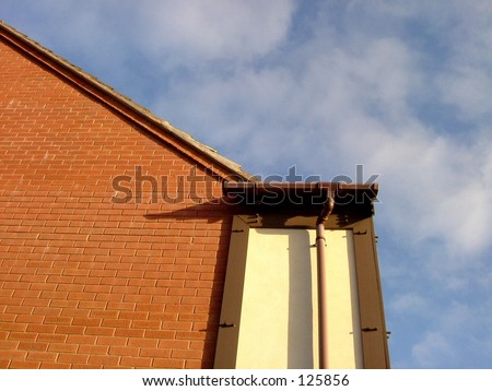 Slanting tiled roof and piped wall