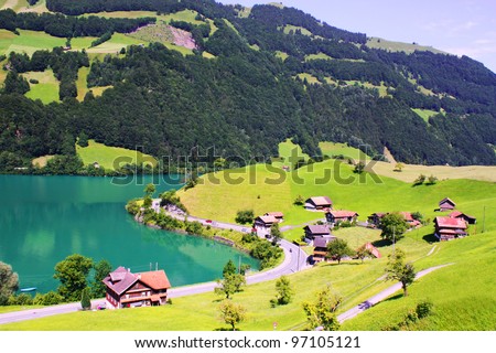 Beautiful Switzerland landscape with houses, lake and mountain