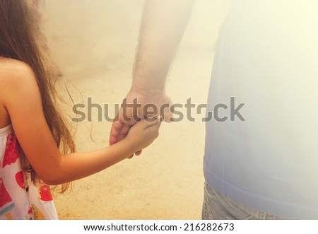 Vintage portrait of Father and daughter holding hand in hand in summer day