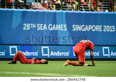 KALLANG,SINGAPORE-JUNE 11:Singapore players look dejected the 28th SEA Games Singapore 2015 Group A match between Singapore and Indonisia at Jalan Besar Stadium on JUNE11 2015 in,SINGAPORE.