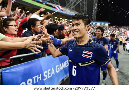 Kallang,Singapore - JUNE 15:Sarach Yooyen thank fans and celebrates winning the gold medal. 28th SEA Games Singapore 2015 at Singapore National Stadium on JUNE15 2015