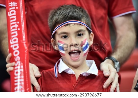 Kallang,Singapore - JUNE 15:Unidentified fan of Thailand national supporters during the 28th SEA Games Singapore 2015 match between Thailand and Myanmar at Singapore National Stadium on JUNE15 2015