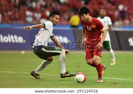 Kallang,Singapore JUNE15:NGUYEN Cong Phuong(Red) of Vietnam in action during the 28th SEA Games Singapore 2015 match between Vietnam and Indonesia at Singapore National Stadium on JUNE15 2015