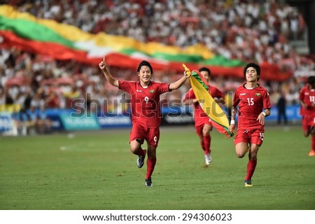 Kallang,Singapore - JUNE 13:Myanmar National team celebrates winning the 28th SEA Games Singapore 2015 match between Myanmar and Vietnam at Singapore National Stadium on JUNE13 2015