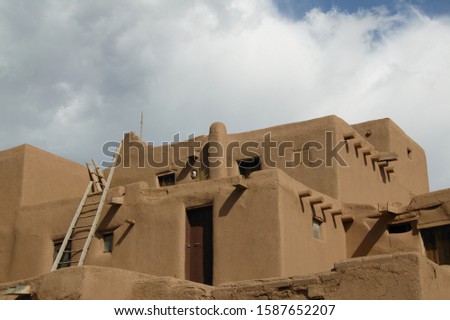 Low angle view of an adobe house, Taos pueblo, New Mexico, USA