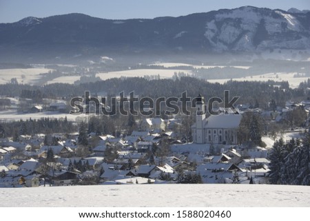 Snow covered town in mountains, Lechbruck, Upper Bavaria, Germany