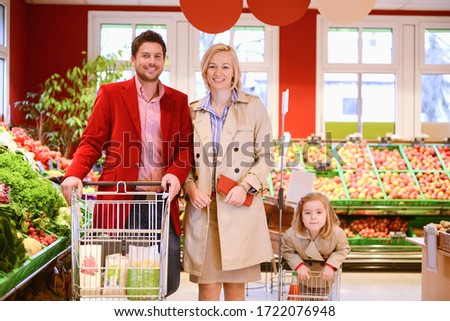Family shopping in an organic grocery store, portrait