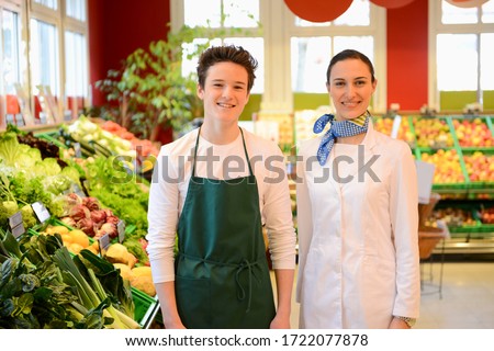 Salesperson and trainee in an organic grocery store, portrait