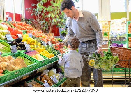 Father and son shopping in an organic grocery store