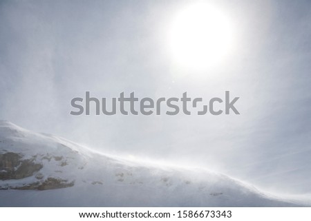 Sun rising over snow-capped mountains in Fimbatal, the border between Switzerland and Austria, near Eschol