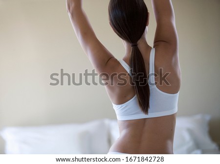 A young woman stretching in the morning