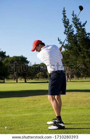 Man playing golf  in his spare time