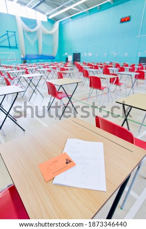 Vertical shot of desks arranged in a wide exam hall
