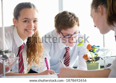 Portrait shot of a high school girl conducting a scientific experiment during a biology class.