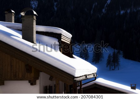 Roofs of the huts covered with snow after a snowfall
