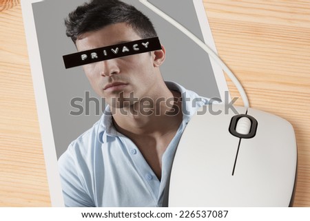 Man picture with his eyes covered by a label with privacy written on it and computer mouse.