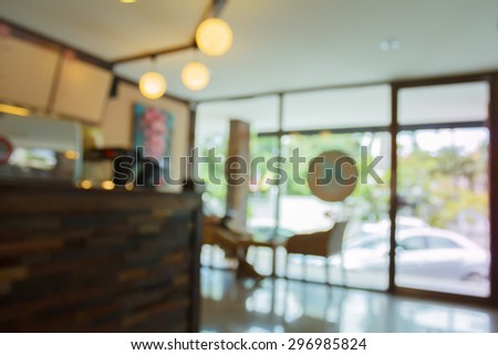 blurred cafe to sit and enjoy a drink for background.Warm tone photo.