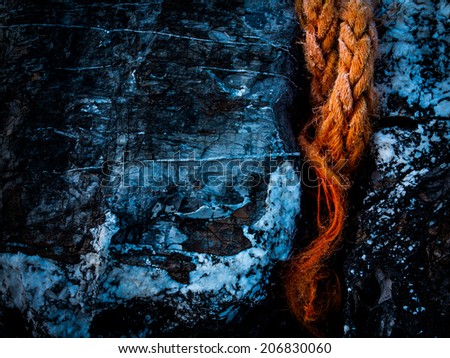 picture of a orange rope on a rock