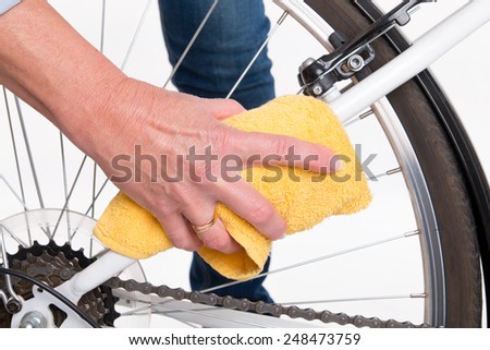 Spring cleaning of the bike frame with a cloth