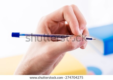 Left-handed holding pen - office