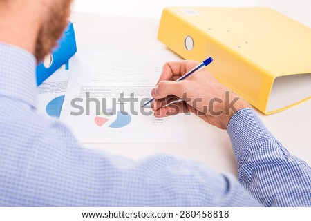 The worker prepares a corporate documents - studio shoot