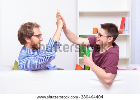 Giving friend a high five at party