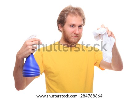 Bearded young man washes using spray and rubber - studio shoot