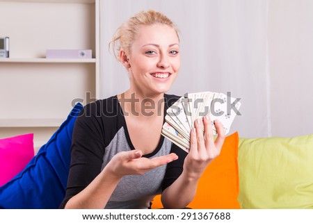 Woman select a card from the deck during game