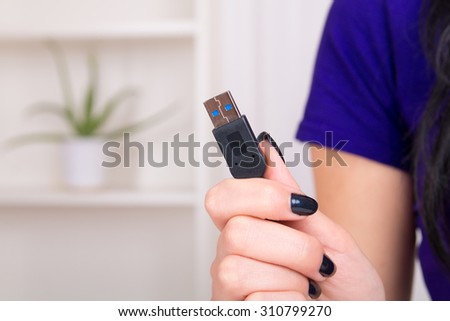 USB cable in hands - home image