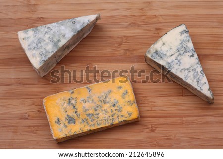 Pieces of blue cheese and Blacksticks Blue Cheese. Close-up.