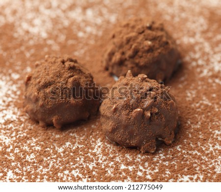 Homemade chocolate truffles with nuts. Close-up.